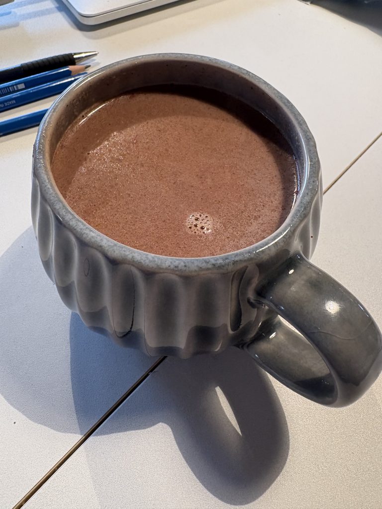 A mug of vegan hot chocolate on a table