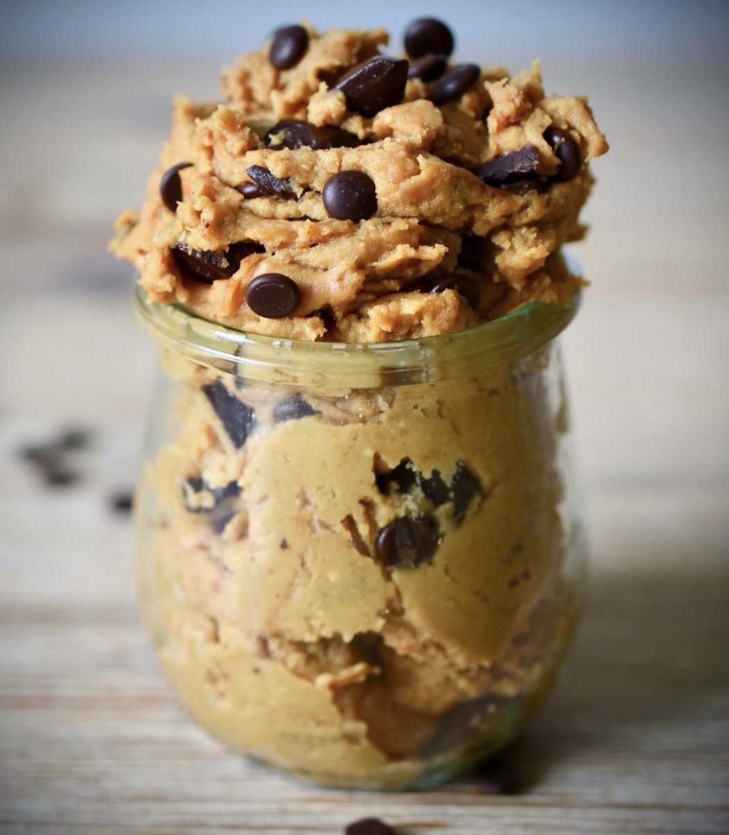 Tasty-looking vegan chickpea cookie dough in a small glass dish