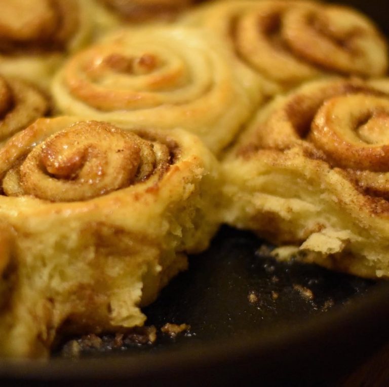 fluffy vegan cinnamon rolls in a pan