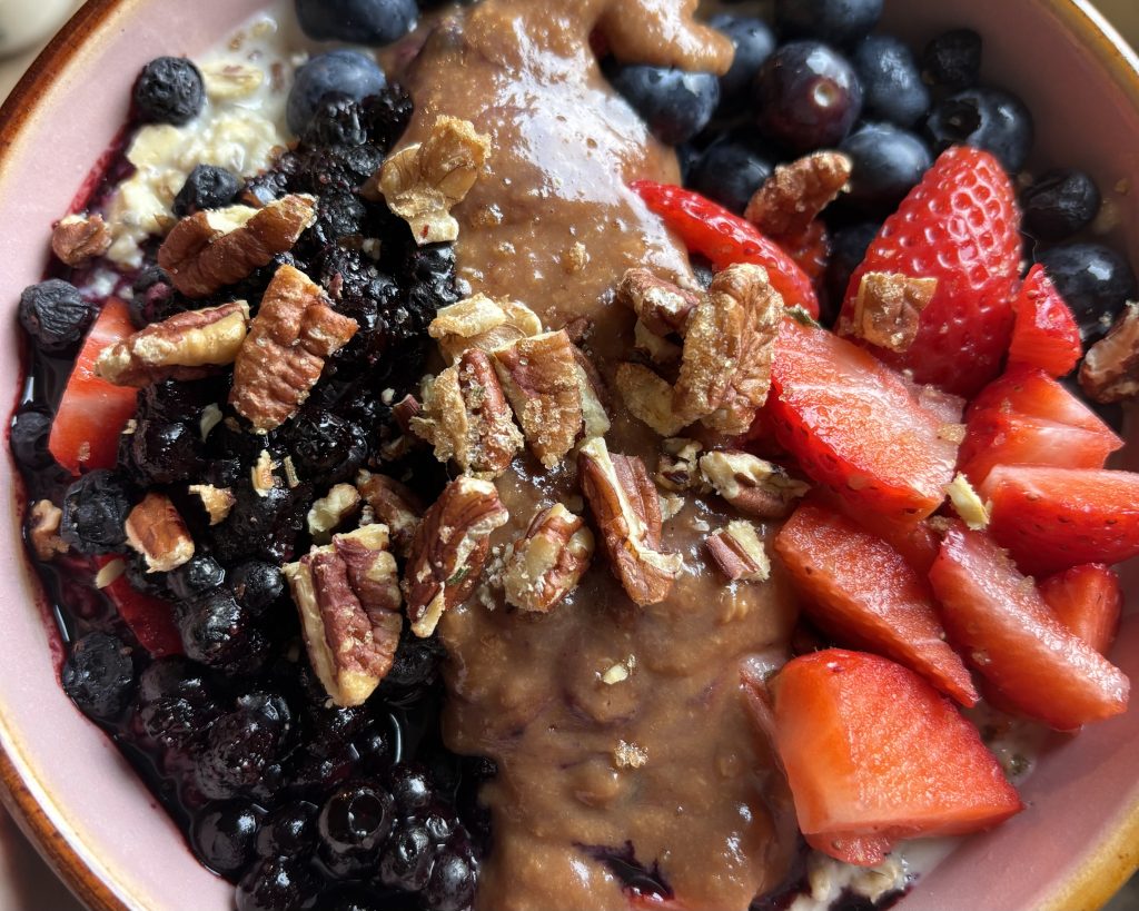 oatmeal in a bowl with fresh fruit and almond butter
