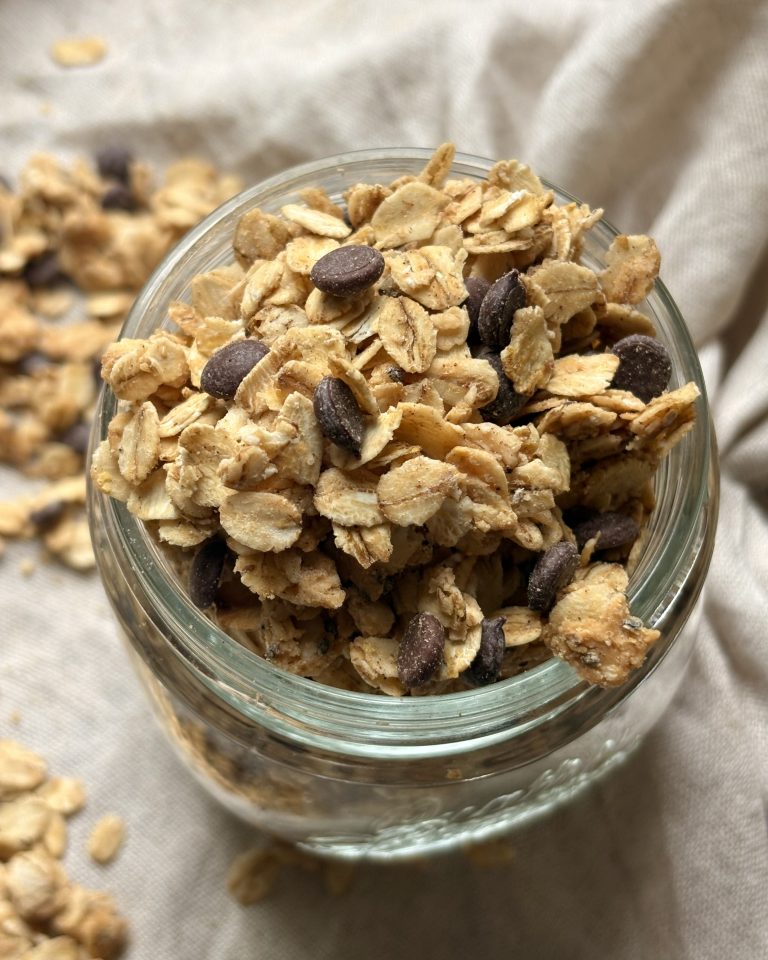 low sugar chocolate peanut butter granola in a glass jar
