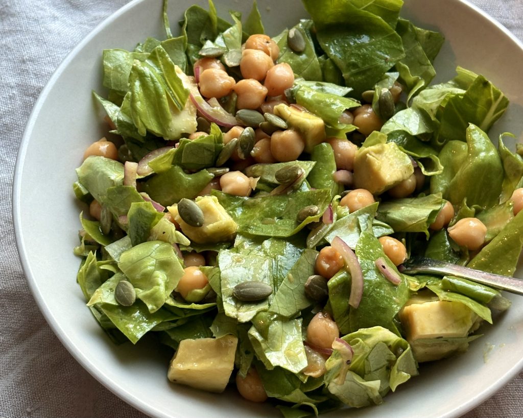 vegan chickpea avocado salad with lettuce and red onions