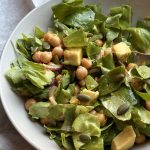 vegan chickpea avocado salad with lettuce and red onions
