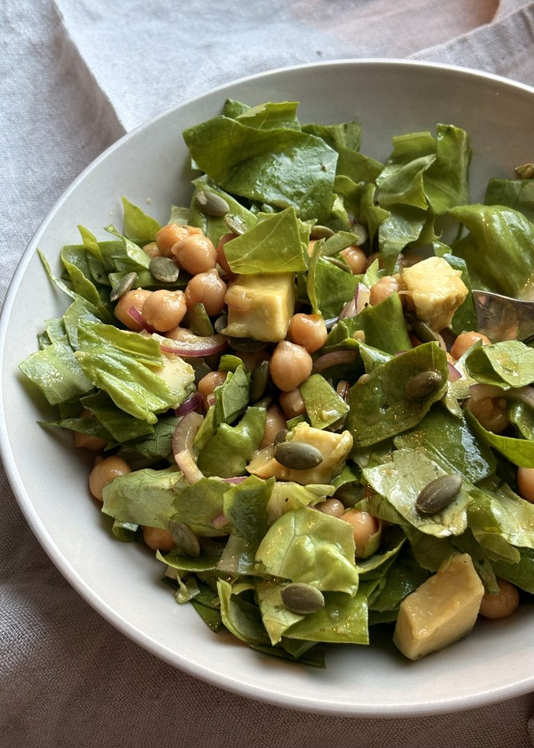 vegan chickpea avocado salad with lettuce and red onions